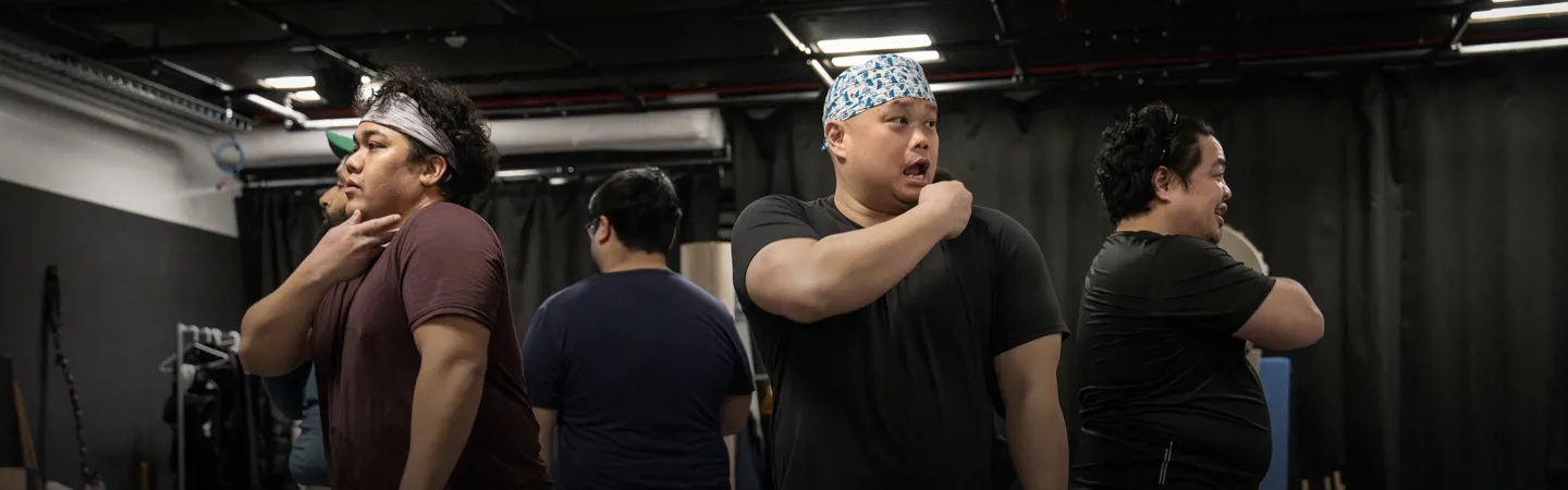 The company of SUMO in rehearsal