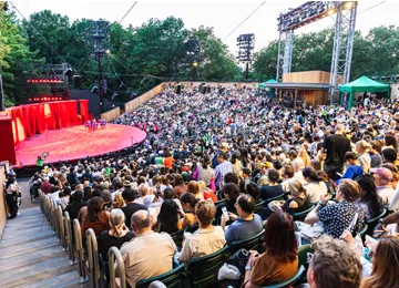 The audience in The Delacorte Theater attending TWELFTH NIGHT photo by Rebecca J. Michelson